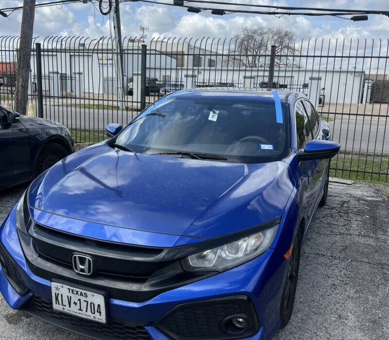 Blue Honda Civic in a parking lot after a detailing job